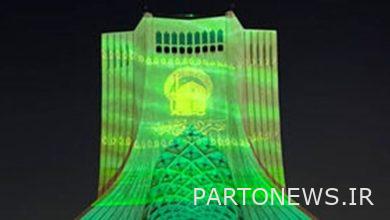The role of the flag of the Razavi shrine on the Freedom Tower of Tehran