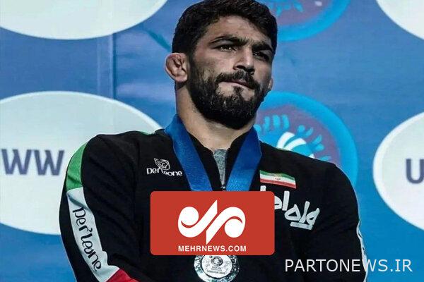 حزن حسن يزداني لحظة تسليم الميدالية بجانب ديفيد تيلور - وكالة مهر للانباء |  إيران وأخبار العالم