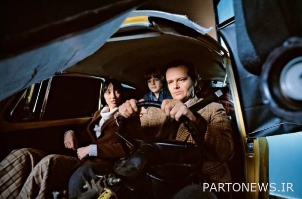 A behind-the-scenes view of the Torrance family in a Volkswagen Beetle driven by Jack Nicholson, the father of the family.