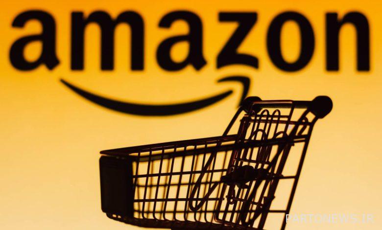 Shopping cart in from of Amazon logo with orange background