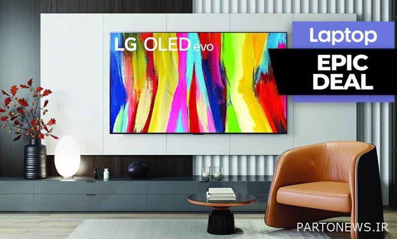 LG OLED C2 TV in a living room next to a brown leather chair