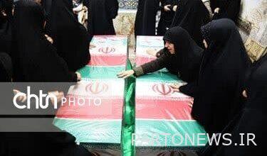 Arya Heritage News Agency - The people of Qom bid farewell to the holy bodies of martyrs Aghazadeh and Karimi
