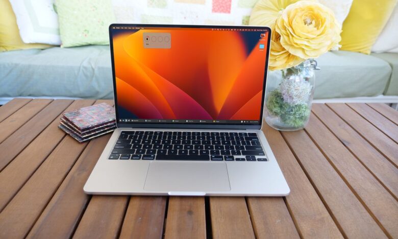 Ubar Taskbar App displayed on a 13-inch MacBook Air M3 open facing the camera on a wooden table