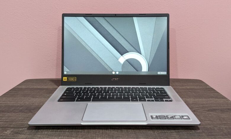 Best Chromebook deals Acer Chromebook 514 on a wooden desk against a pink background