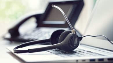 Headset headphones telephone and laptop in call center