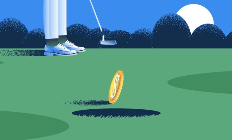 Coin rolling into a golf hole.