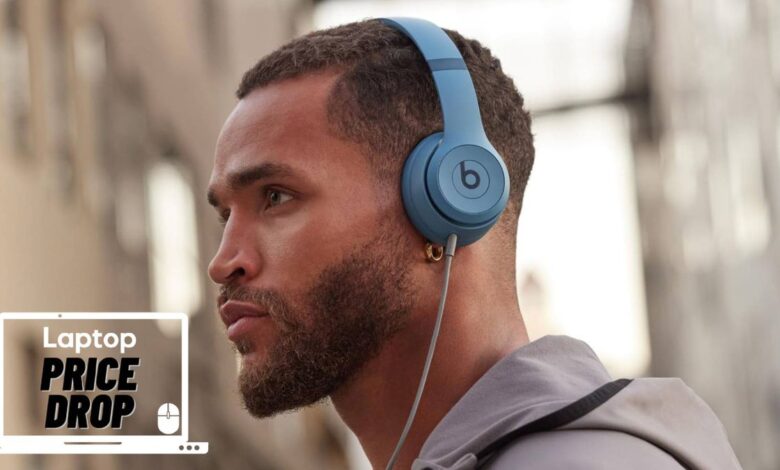 Man wearing Beats Solo 4 headphones in blue colorway