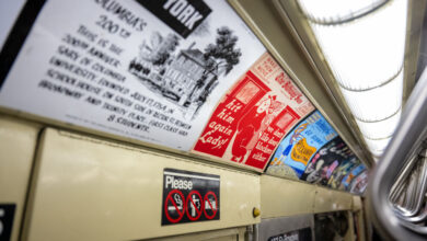 Image of ads inside a subway car.