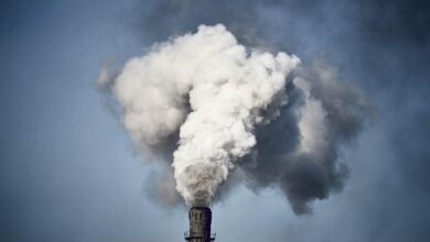 Thick smoke is billowing out of the chimney of a Chinese factory.