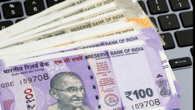 stack of Indian rupees fanned out