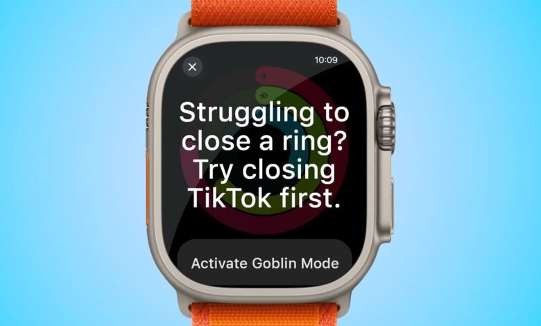 Apple Watch Ultra showing a passive-aggressive notification saying "Struggling to close a ring? Try closing TikTok first." with a button below suggesting to "Active Goblin Mode." Image is set on a blue backdrop.