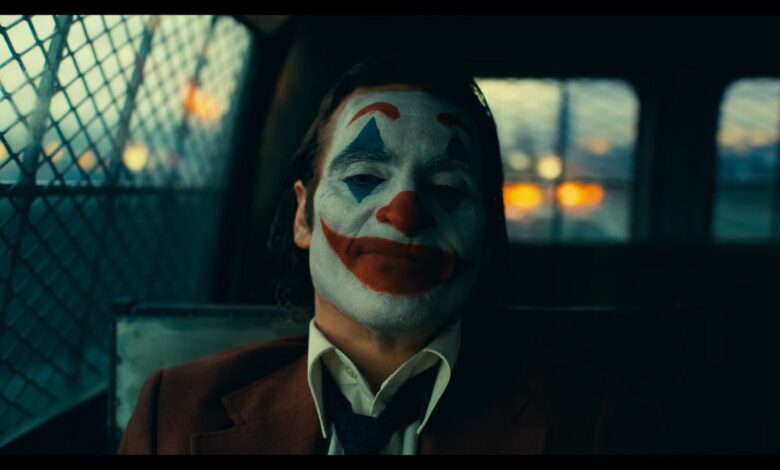 Joker in the back of a cop car.