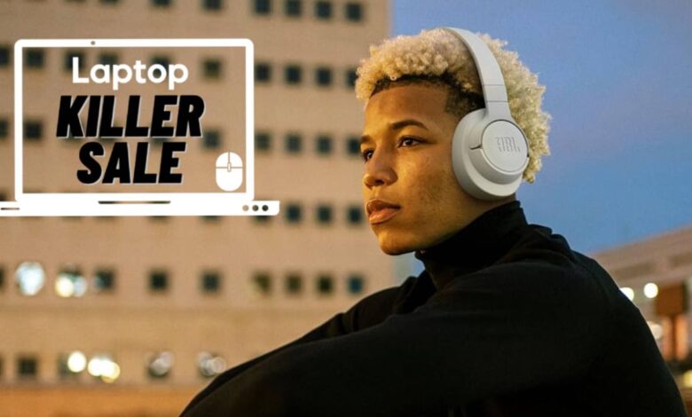 Man outside wearing beige JBL Tune 720BT wireless headphones