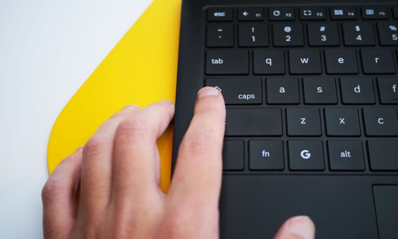 A hand hitting the Quick Insert key on a Samsung Galaxy Chromebook Plus