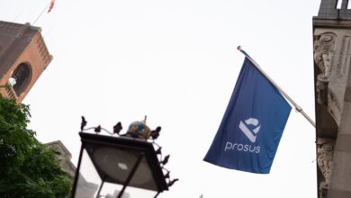A Prosus flag is displayed ahead of the trading debut of the new Prosus NV unit of Naspers Ltd., outside the Amsterdam Stock Exchange.