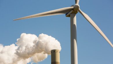 Wind turbine and smokestack with pollution illustrates how US will fall behind Europe and China after Supreme Court EPA ruling