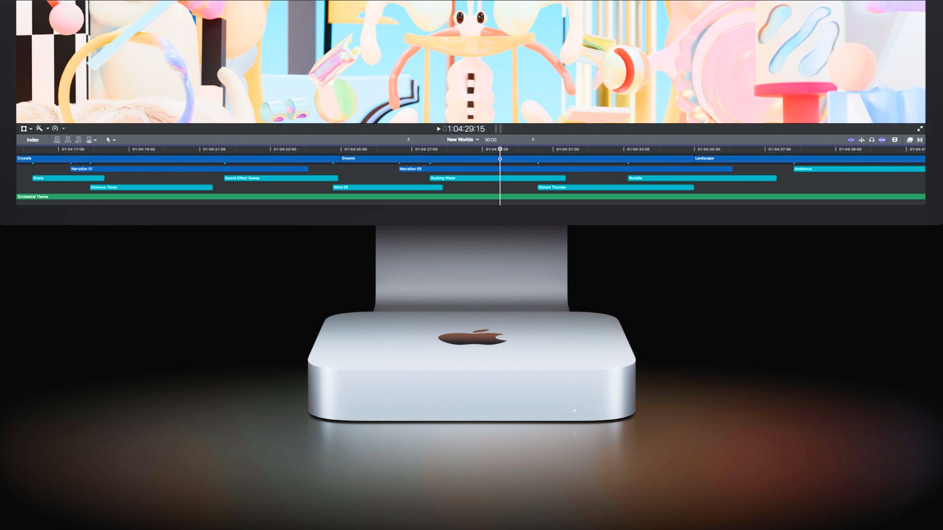 یک مک مینی در مقابل یک صفحه نمایش iMac با پس زمینه سیاه