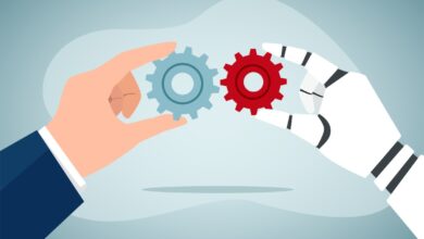 Human and robotic hands connecting gears. People and robots