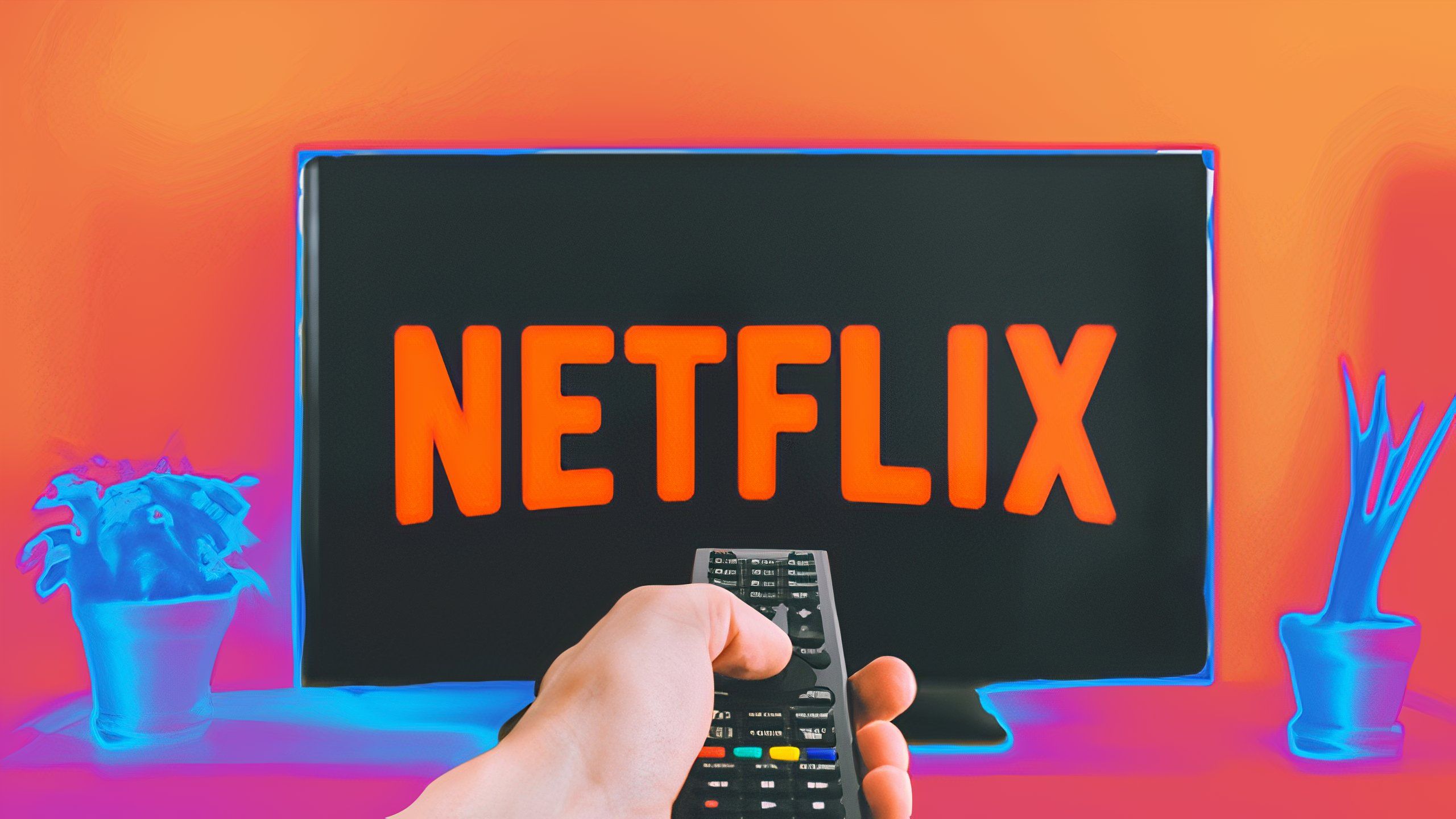 دستی که به آرم Netflix با یک ریموت اشاره می کند.