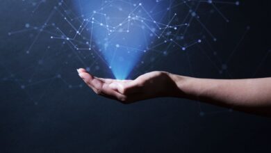 Woman's hand emitting light upwards