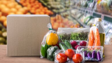 Packaged food on wood table with supermarket background