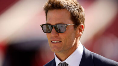 TAMPA, FLORIDA - JANUARY 05: Broadcaster Tom Brady looks on during warm ups prior to the game between the New Orleans Saints and the Tampa Bay Buccaneers at Raymond James Stadium on January 05, 2025 in Tampa, Florida. (Photo by Mike Ehrmann/Getty Images)