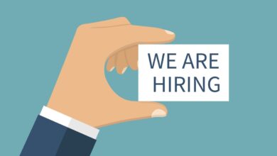 WE ARE HIRING, vector. Card with text in hands.