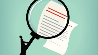 Illustration of a person with a magnifying glass studying a contract.