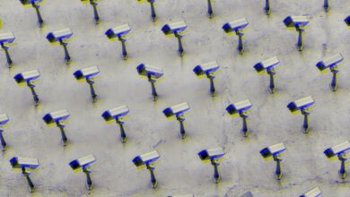 a pattern of CCTV surveillance cameras on a wall, moshed with a blue and yellow jitter effect, all pointing in different directions.