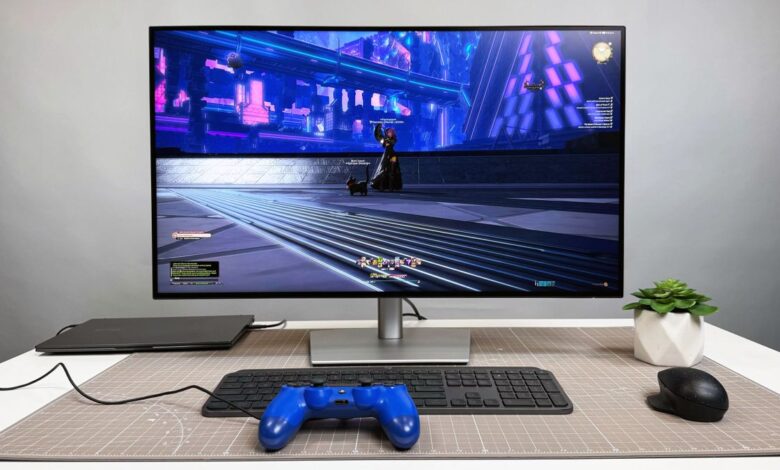 Dell UltraSharp 32 4K Thunderbolt Hub Monitor (U3225QE) on a white desk and gray background.