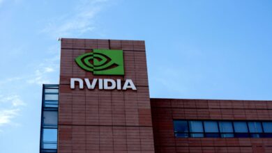Looking up at Nvidia's headquarters with the sky behind it.