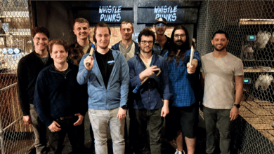 Image of the Plural team at an axe-throwing establishment.