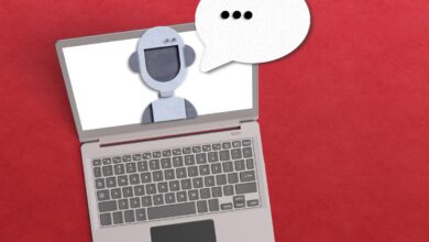 AI agent concept with robot inside a laptop with a voice bubble on red background.