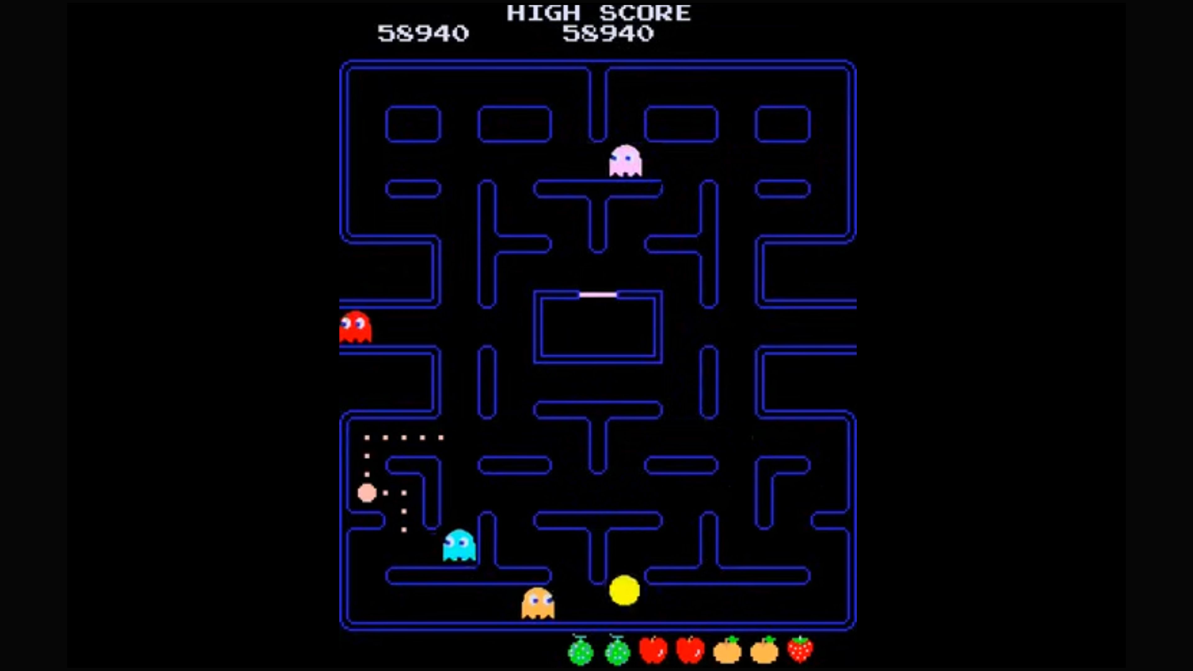 بازی کلاسیک Pac-Man در پس زمینه سیاه.