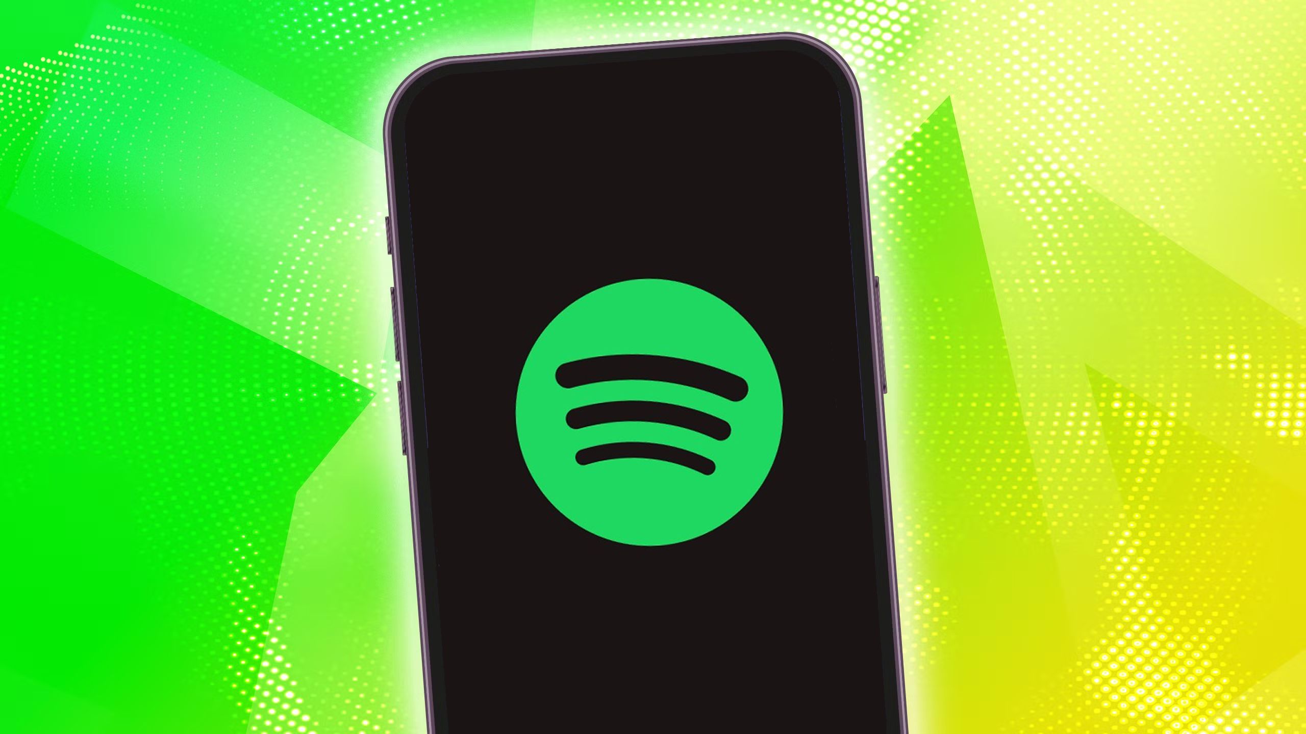 Spotify در آیفون در پس زمینه زرد/صفحه نمایش.