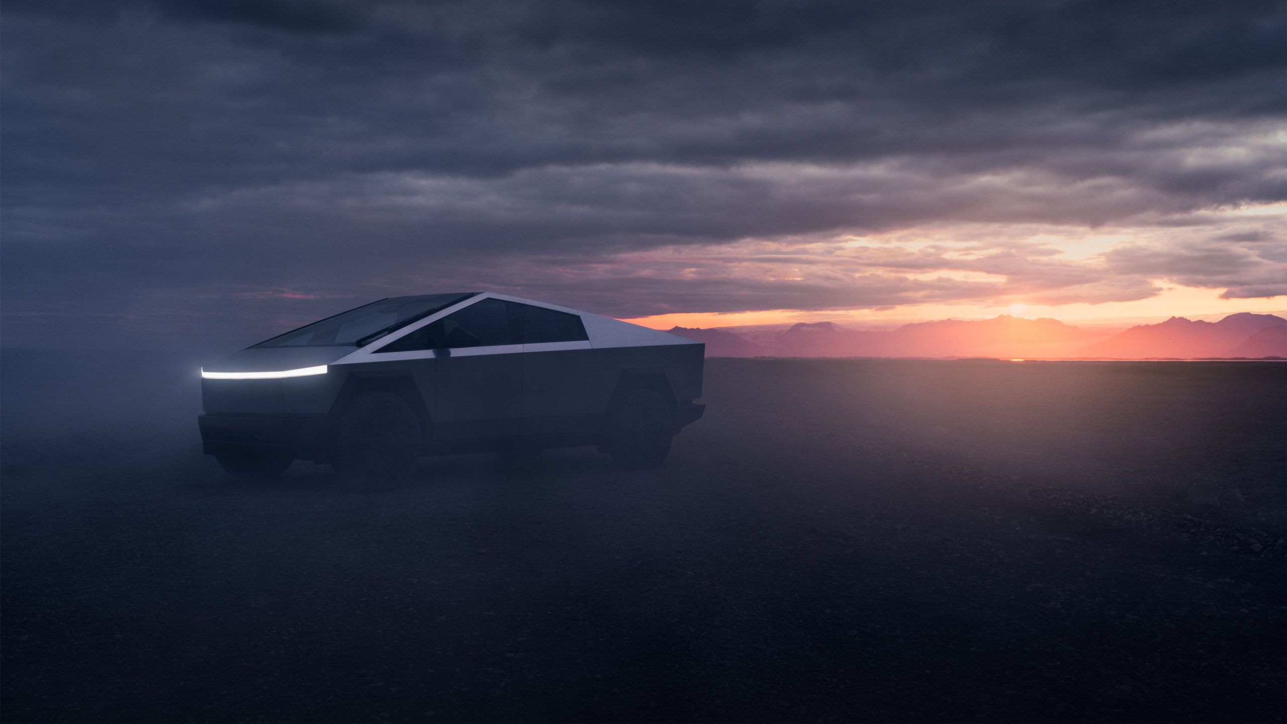 یک Cybertruck Tesla چراغ های خود را هنگام غروب روشن می کند