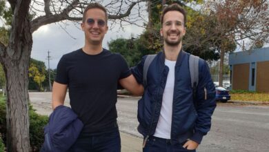 Wasp founders Martin and Matija Sosic standing behind Y Combinator sign