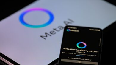 The Meta AI app is displayed on a mobile phone with the Meta AI logo visible on a tablet in this photo illustration