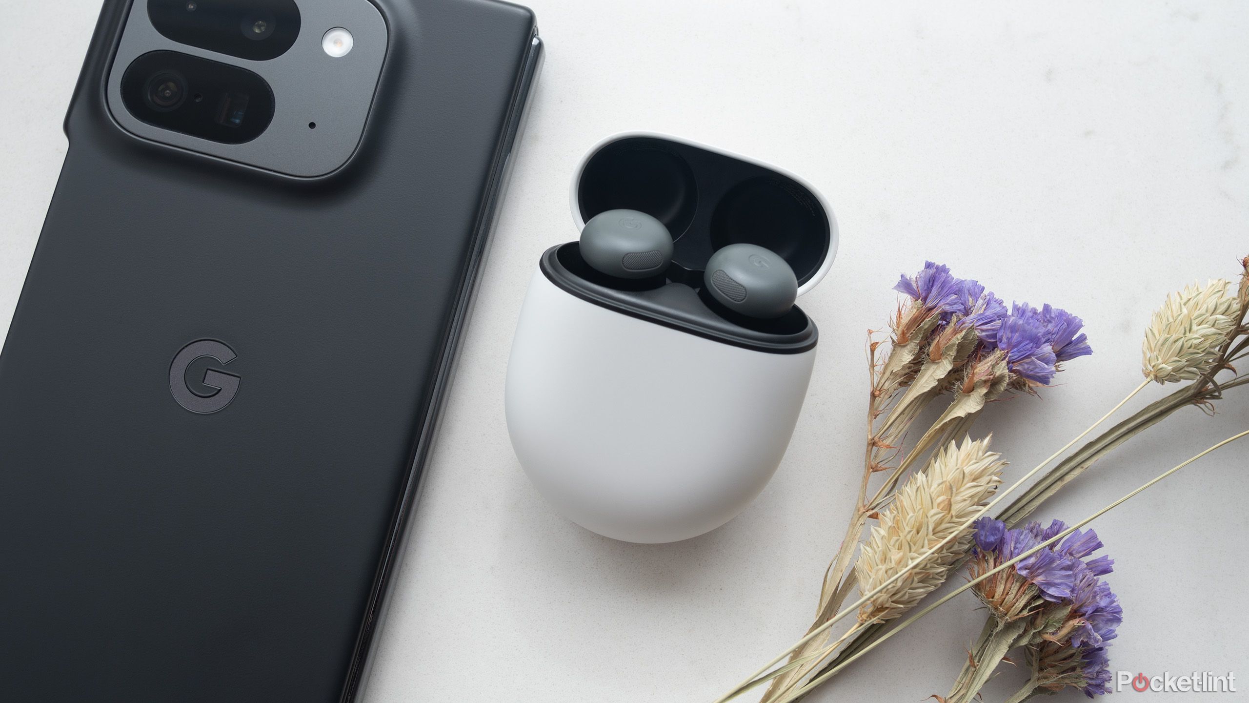 Google's Pixel Buds Pro 2 در کنار Pixel 9 Pro Fold.