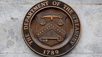 Seal of the U.S. Treasury logo on the wall of the Treasury building in DC
