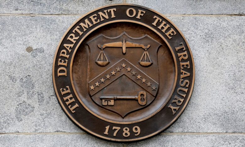 Seal of the U.S. Treasury logo on the wall of the Treasury building in DC