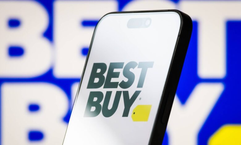 Best Buy logo with white background on a smartphone against a blue background Best Buy logo