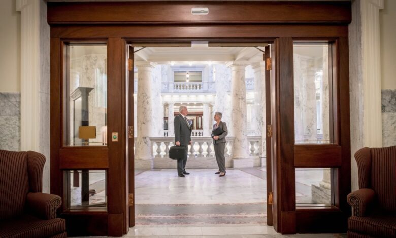 Politicians talking in capitol building