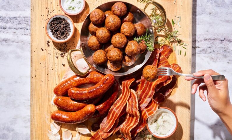 A selection of alternative meat products displayed on a table.
