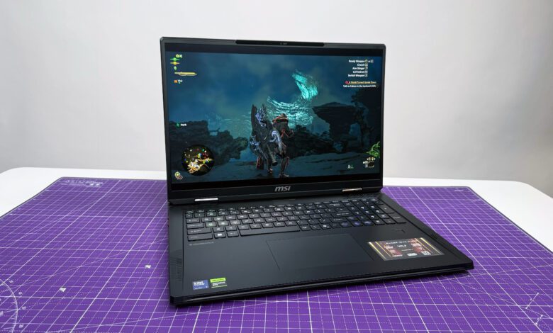 MSI Raider 18 HX AI gaming laptop open facing on a purple mat against a gray background.