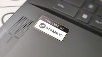 Photograph of a gaming laptop deck with a 'Powered by SteamOS' badge added to the image.