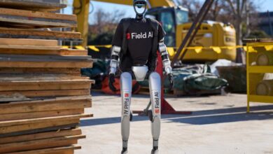 Image of a humanoid robot with FieldAI logos.