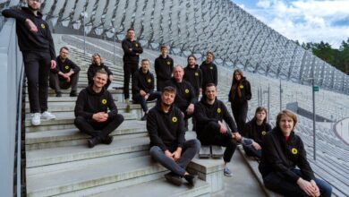 Handwave team photo sitting on concrete steps