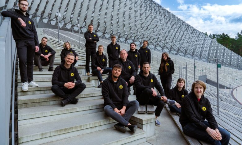 Handwave team photo sitting on concrete steps