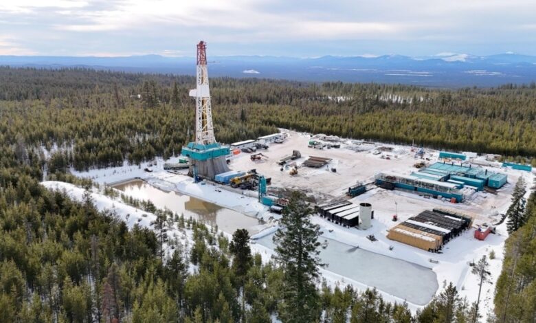 A geothermal drilling rig sits in a forest in Oregon.